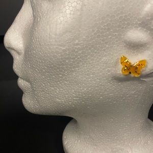Butterfly stud earrings with resin and gold colored  stripes